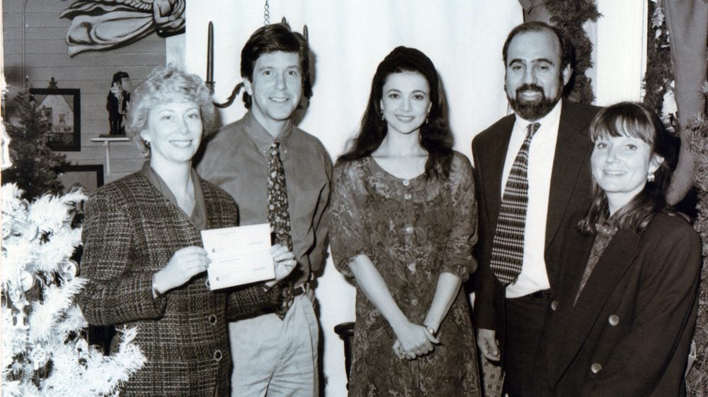 Tom Bergeron and Emma Samms joining Gary and Judi Vaillancourt in 1993 during the 4th introduction of Vaillancourt Folk Art's Starlight Santa.