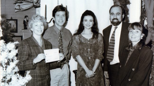 Tom Bergeron and Emma Samms joining Gary and Judi Vaillancourt in 1993 during the 4th introduction of Vaillancourt Folk Art's Starlight Santa.