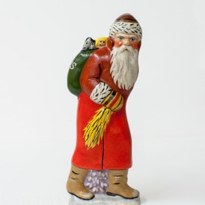 Father Christmas with teddy in back pocket