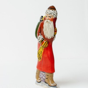 Father Christmas with teddy in back pocket
