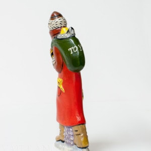 Father Christmas with teddy in back pocket