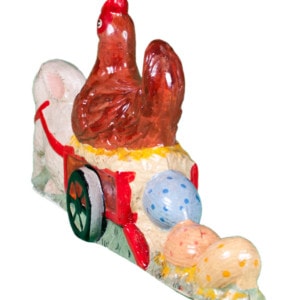 Rabbit Pulling Hen in Wagon Laying Eggs
