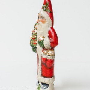 Santa Holding Tree of Ornaments
