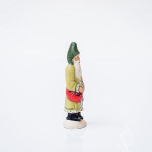 Miniature Father Christmas in Green Holding Purple Rabbit