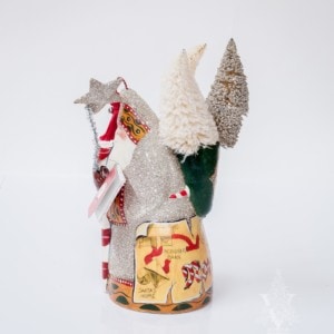 Shimmering North Pole Santa with Book and Trees