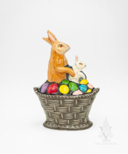 Two Rabbits in a Basket of Colored Eggs