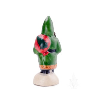 Small Green Father Christmas Trudging Thru Snow