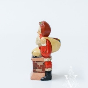 Santa Pushing Sack into Chimney