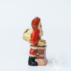 Santa Pushing Sack into Chimney