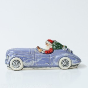 Santa in Jaguar with Bergdorf Gifts