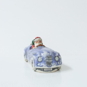 Santa in Jaguar with Bergdorf Gifts