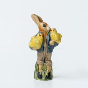 Rabbit Holding Two Chicks