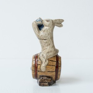 Rabbit Sitting on Barrel Drinking